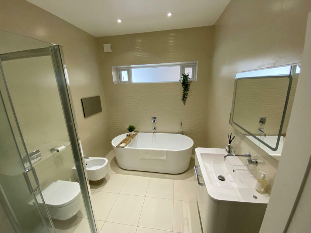 Experienced plumber installing new bathroom in a residential property in Acton